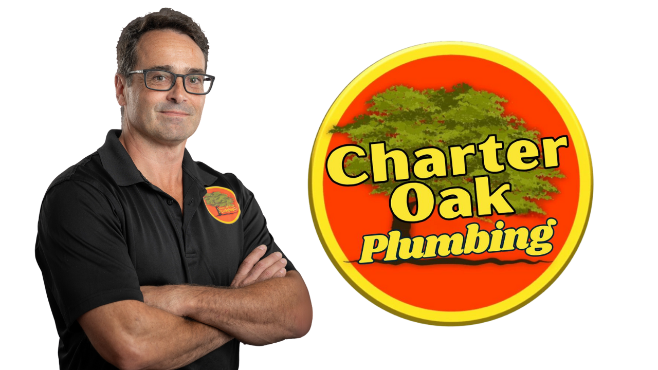 Owner of Charter Oak Plumbing wearing company uniform, confidently smiling with arms crossed — expert plumber serving Southington, CT and surrounding areas.